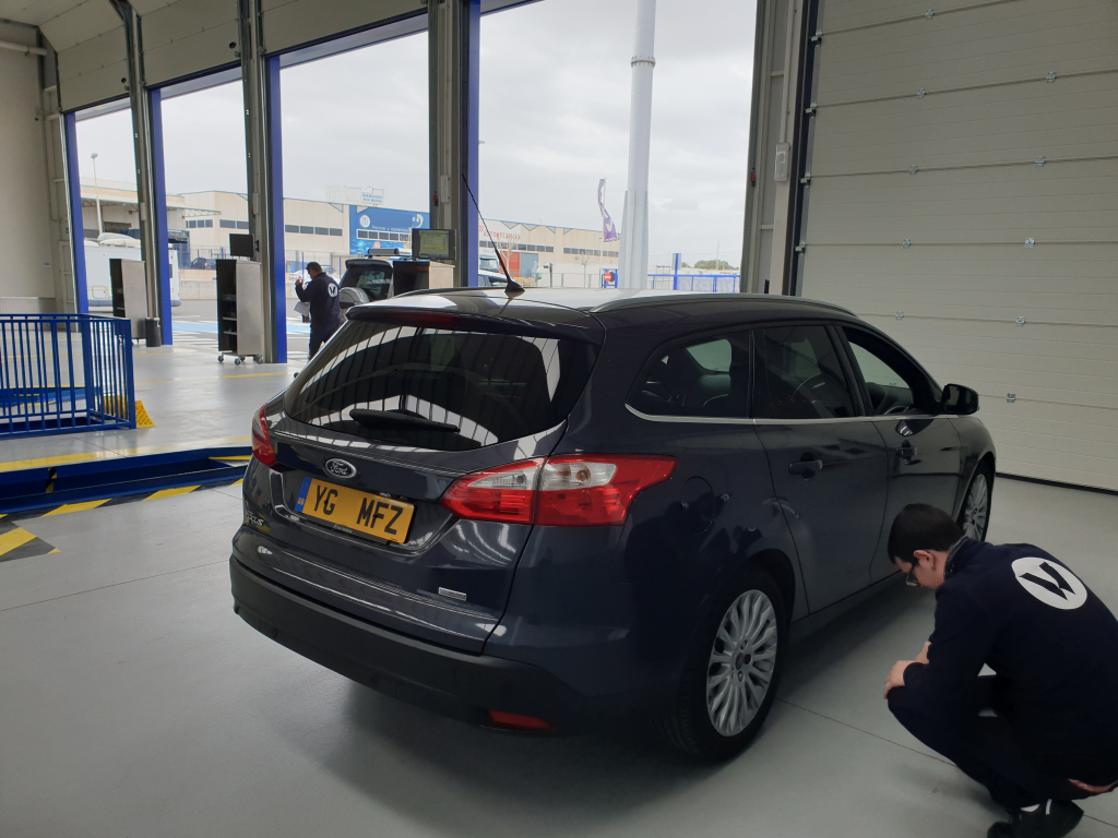 Ford Focus Estate has tyres inspected during ITV import test Ford Focus Estate inside ITV test centre